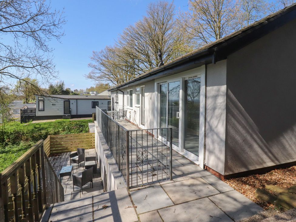 An outdoor area with decking and outdoor furniture at Beacon Fell Cottage 1 Preston