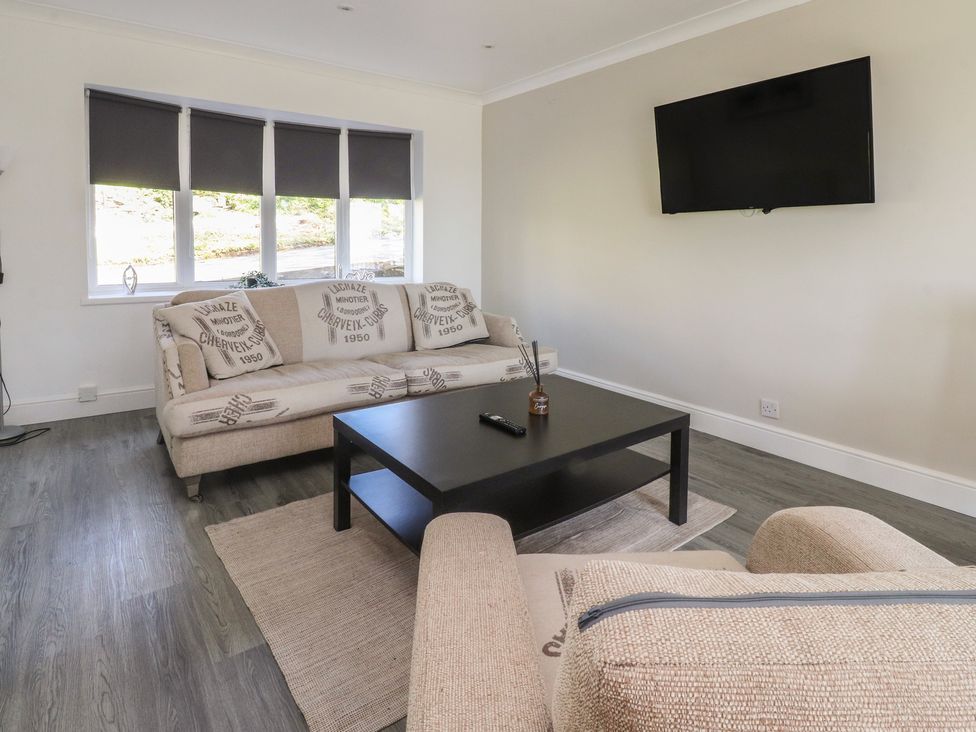 A living room with a sofa and coffee table at Beacon Fell Cottage 1 Preston