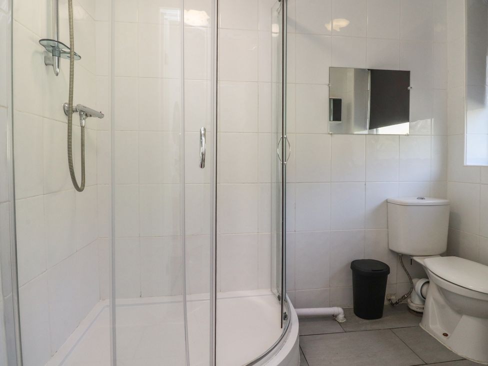 A bathroom with a shower and toilet at Beacon Fell Cottage 1 Preston
