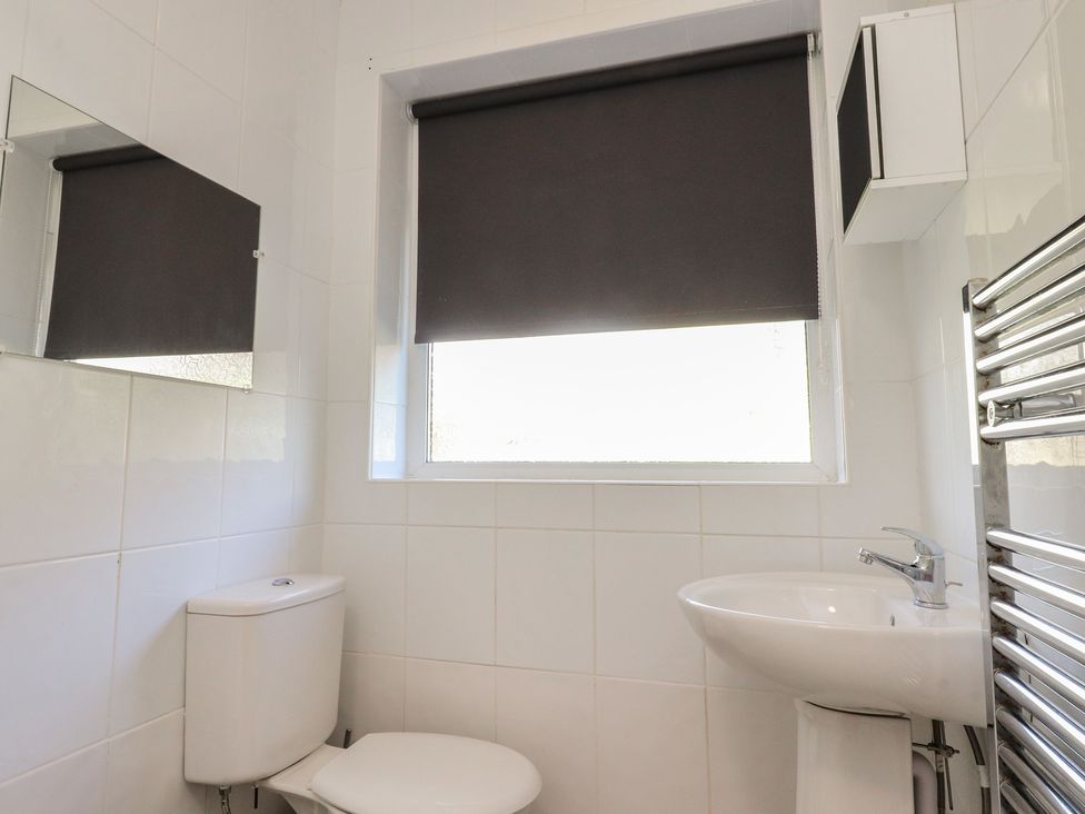 A bathroom with a toilet and sink at Beacon Fell Cottage 1 Preston