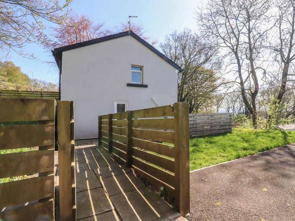 A house with a pathway and fence at Beacon Fell Cottage 2 Longridge