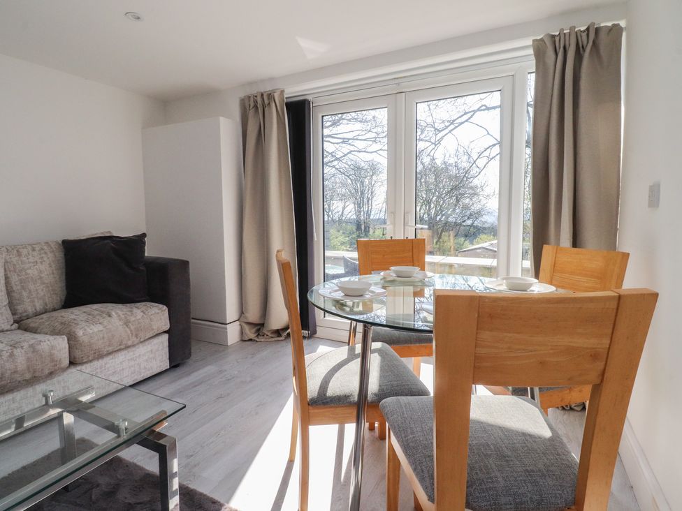 A dining room with a table and chairs at Beacon Fell Cottage 2 in Longridge