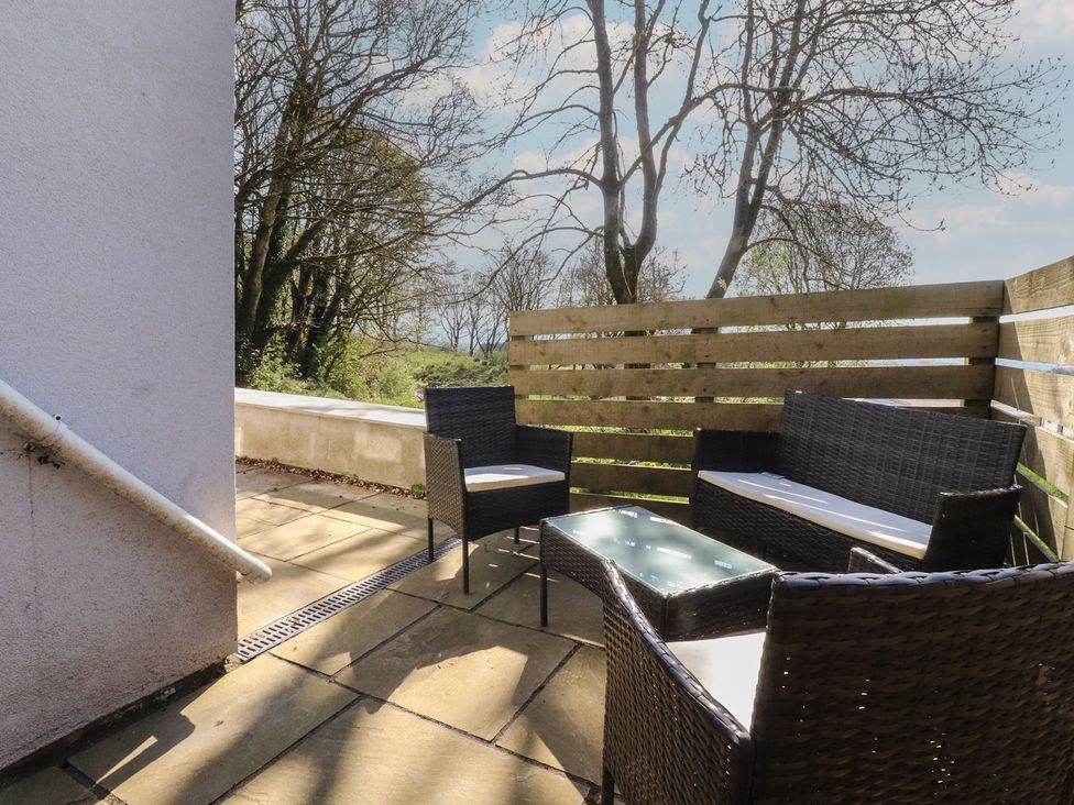 An outdoor seating area with furniture at Beacon Fell Cottage 2 Longridge