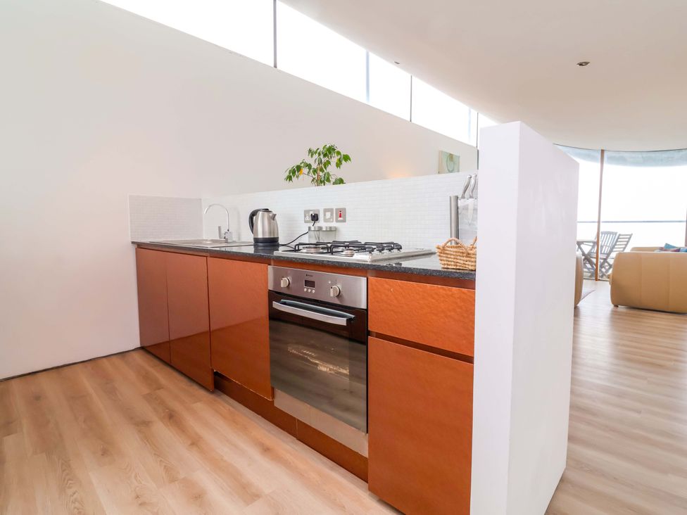 A kitchen with a sink and stove at 12 Nautilus in Westward Ho!