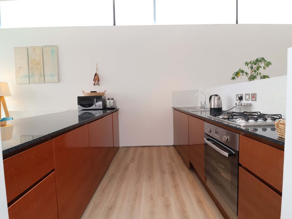 A kitchen with countertops and appliances at 12 Nautilus in Westward Ho!