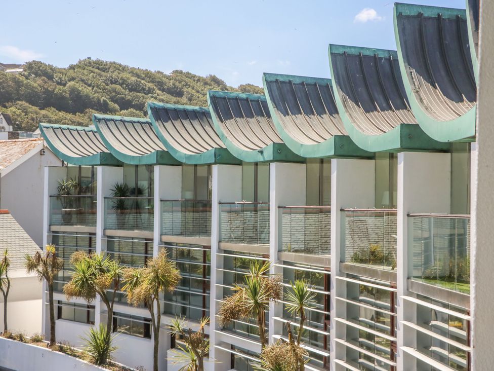 A building with balconies and plants at 12 Nautilus, Westward Ho!