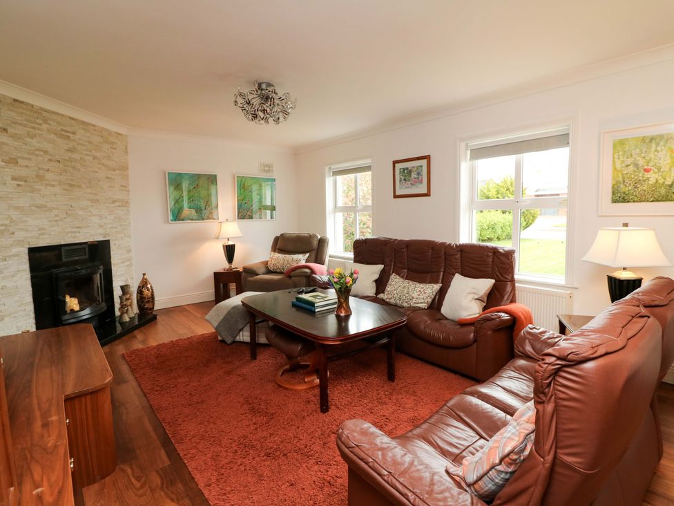 A living room with sofas and a coffee table at Sunnyside River Chapel