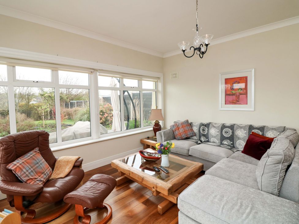 A living room with a sofa and coffee table at Sunnyside in River Chapel