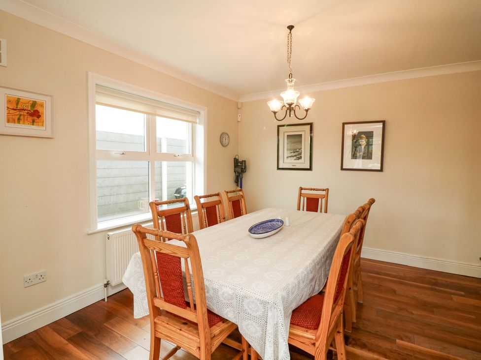 A dining room with a table and chairs at Sunnyside in River Chapel