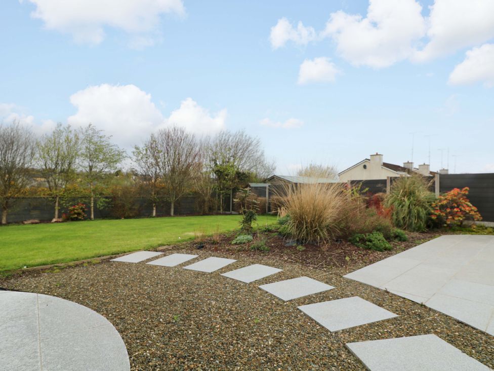 A garden with a pathway and plants at Sunnyside River Chapel