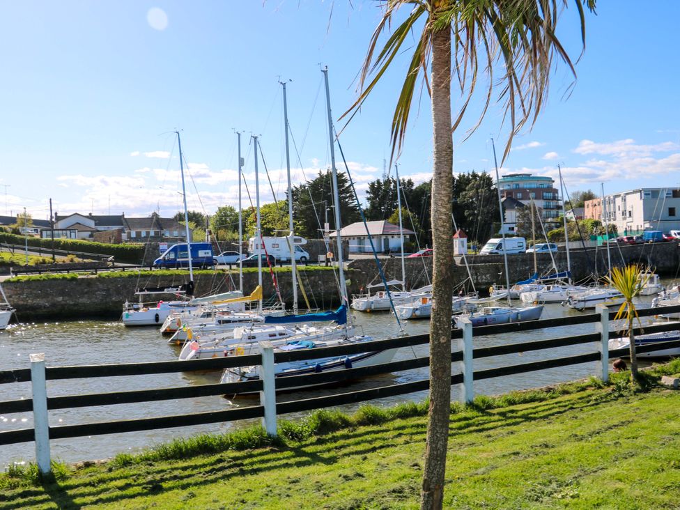 A view of boats on water near a fence at Sunnyside in River Chapel