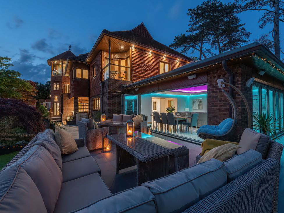 An outdoor seating area with a sofa and coffee table at Hamble House in Southampton