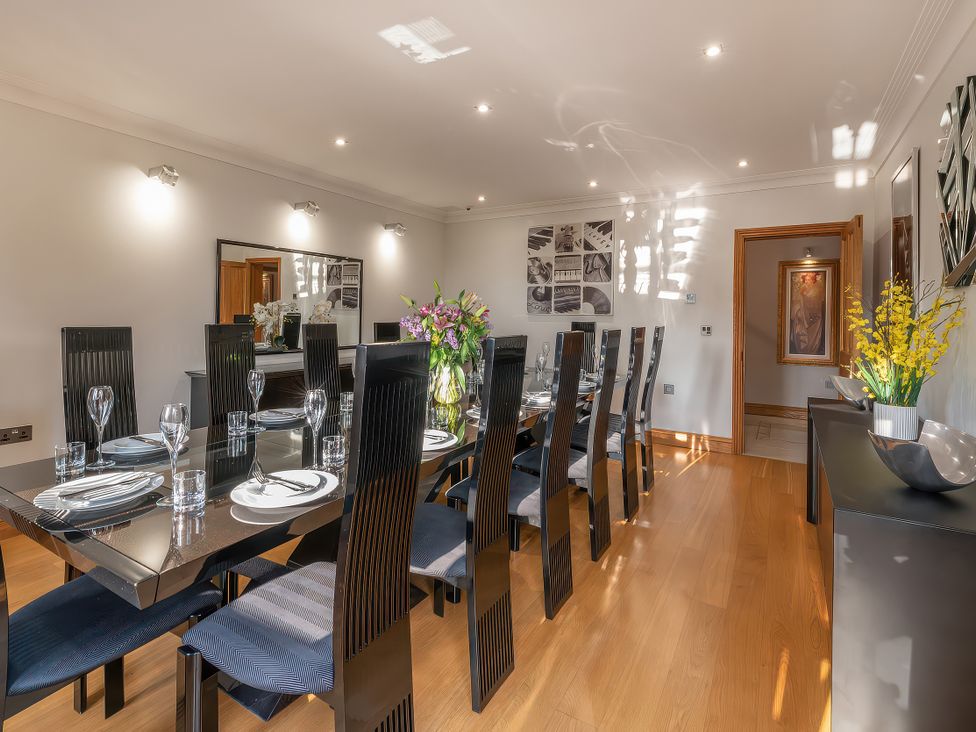 A dining room with a large table and chairs at Hamble House in Southampton