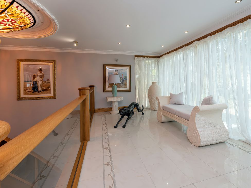 A lounge with artwork and a sofa at Hamble House in Southampton