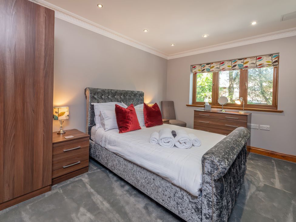 A bedroom with a bed and chest of drawers at Hamble House in Southampton