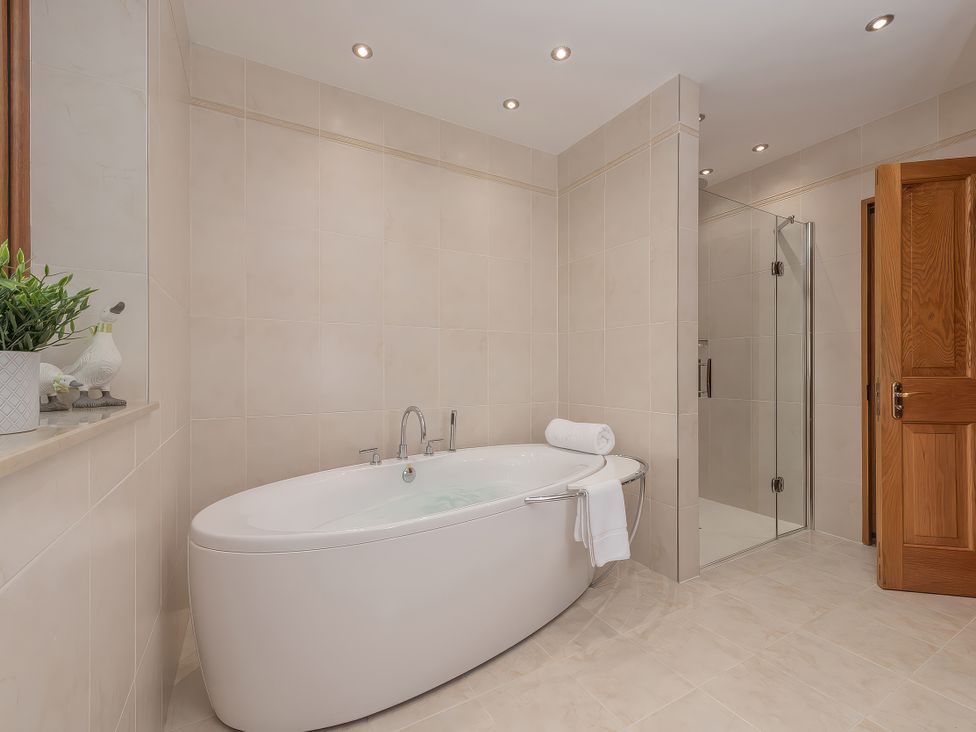 A bathroom with a bathtub and shower at Hamble House in Southampton