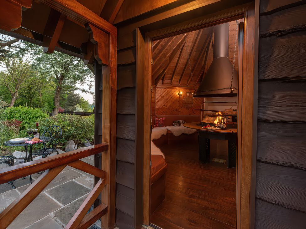 A view from an entrance to a room with a fireplace at Hamble House in Southampton