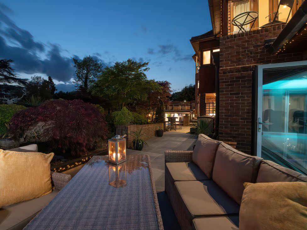 An outdoor area with a sofa and table at Hamble House in Southampton