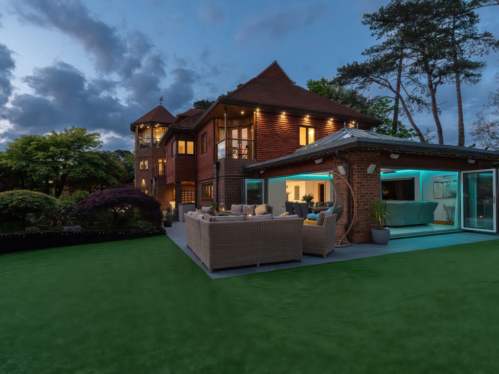 An outdoor view of a house with seating area in the garden at Hamble House in Southampton