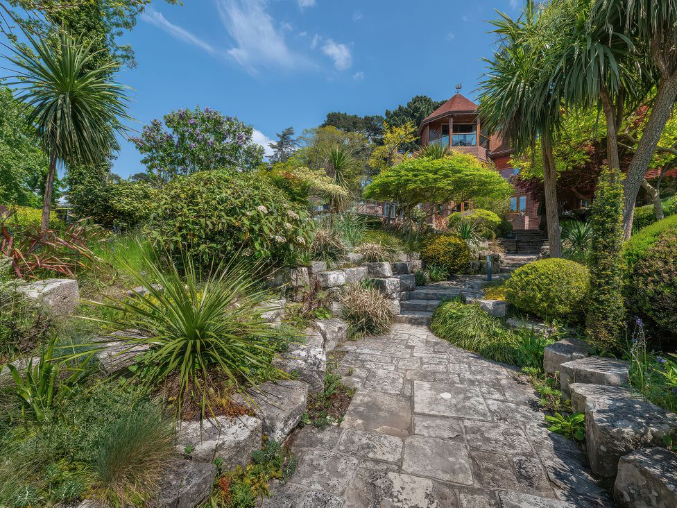 A garden with a pathway and various plants at Hamble House in Southampton