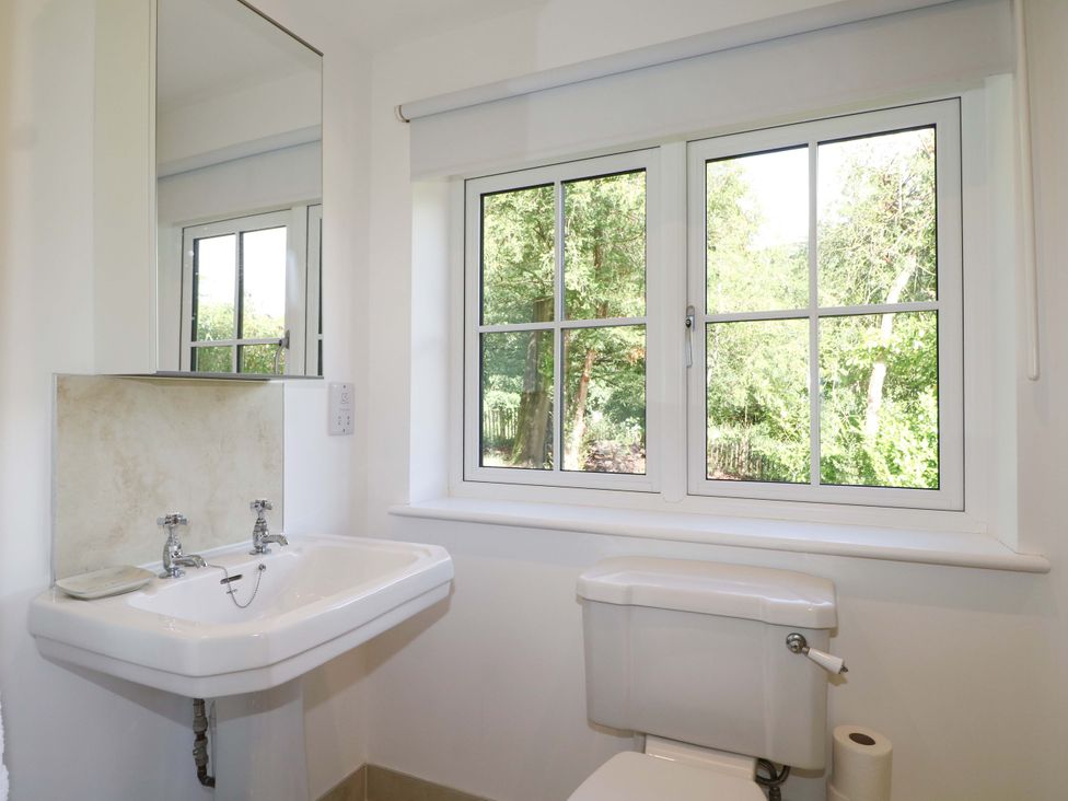 A bathroom with a sink and toilet at Keepers Cottage in Petersfield