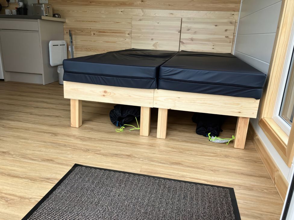A bed with a mattress in a sleeping area at Sherwood - Cosy Pod 6 Mansfield