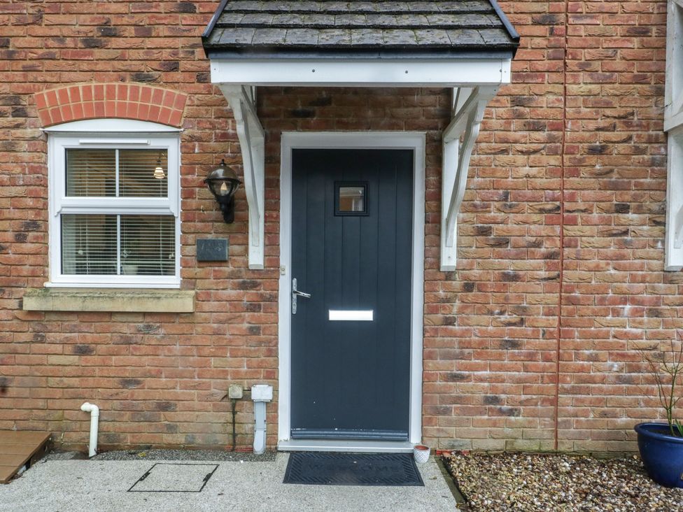 A front entrance with a door and window at 42 Ynys Y Nos in Glynneath