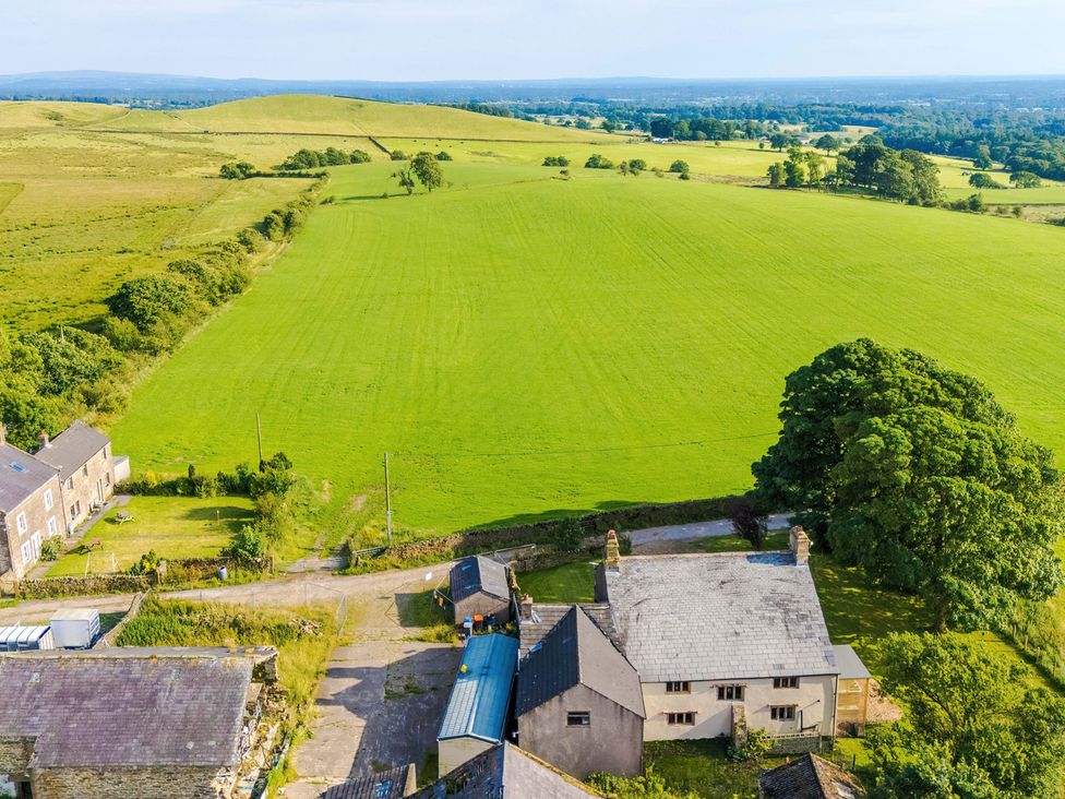 An aerial view of a field and buildings at Landskill Farm in Preston