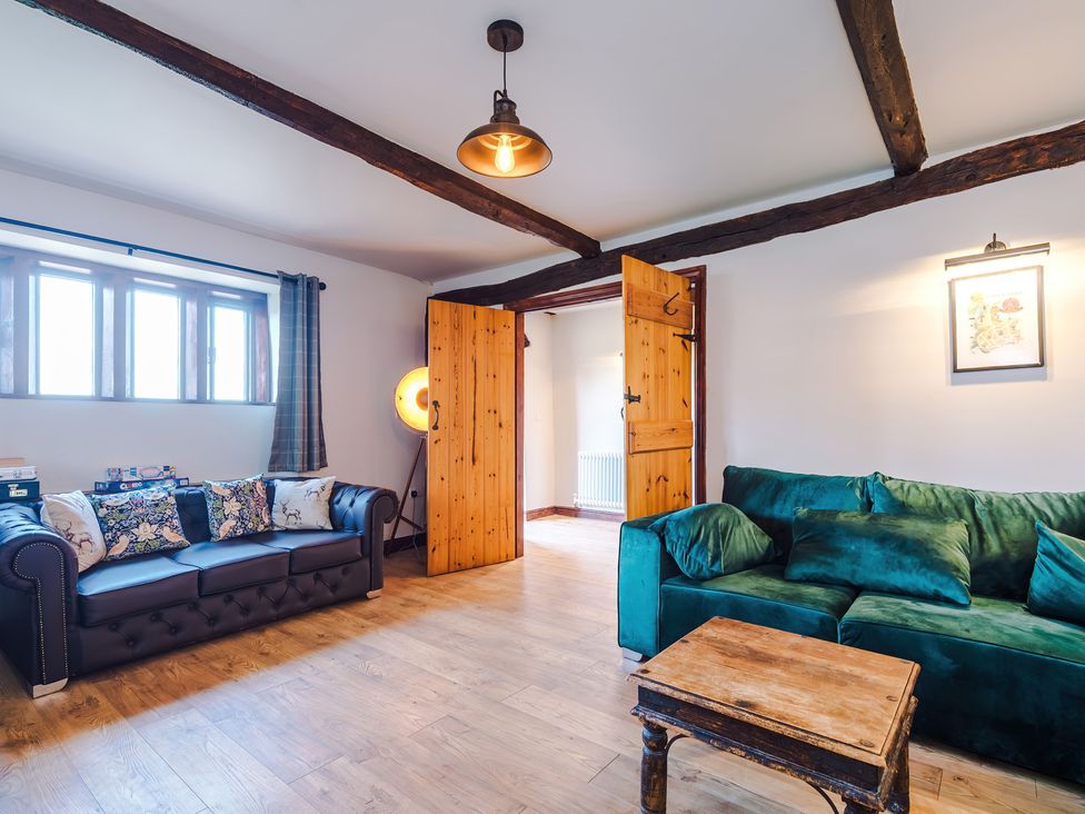 A living room with a sofa and a coffee table at Landskill Farm in Preston