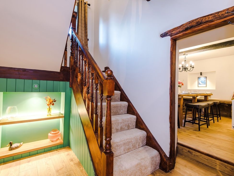 A staircase leading to an upper level at Landskill Farm in Preston