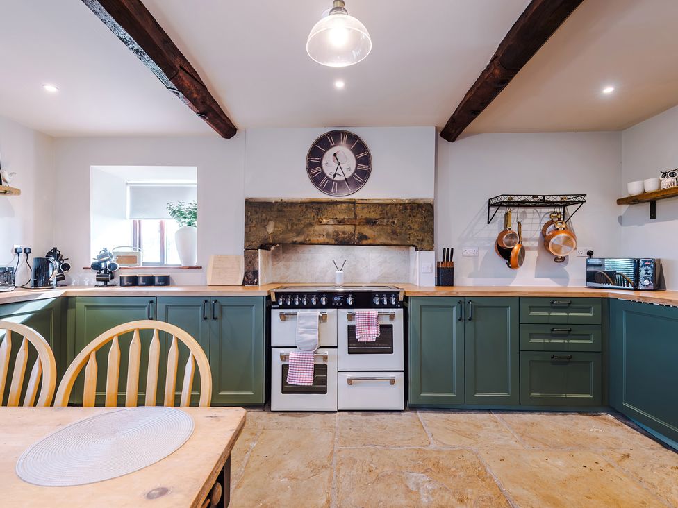 A kitchen with a stove and sink at Landskill Farm in Preston