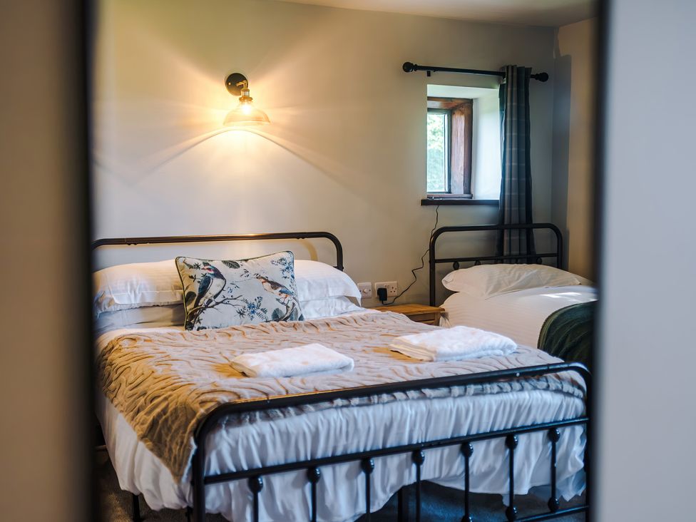 A bedroom with two beds at Landskill Farm in Preston