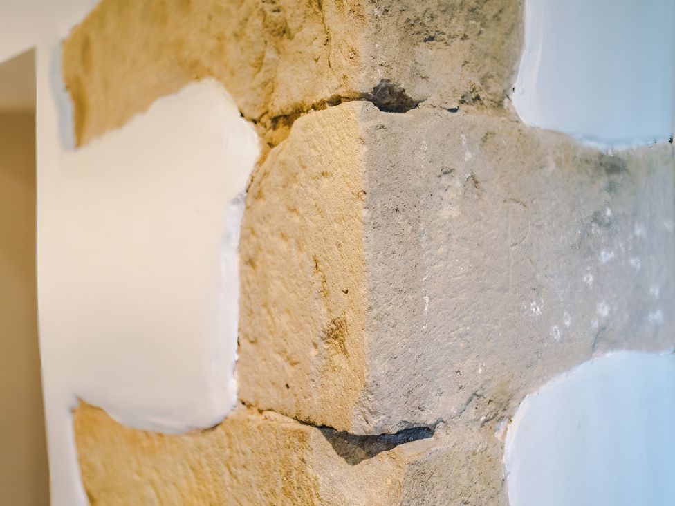 A stone wall with plaster at Landskill Farm in Preston