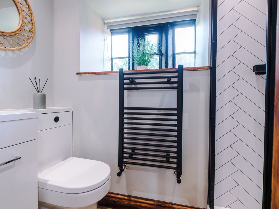 A bathroom with a toilet and a towel radiator at Landskill Farm in Preston