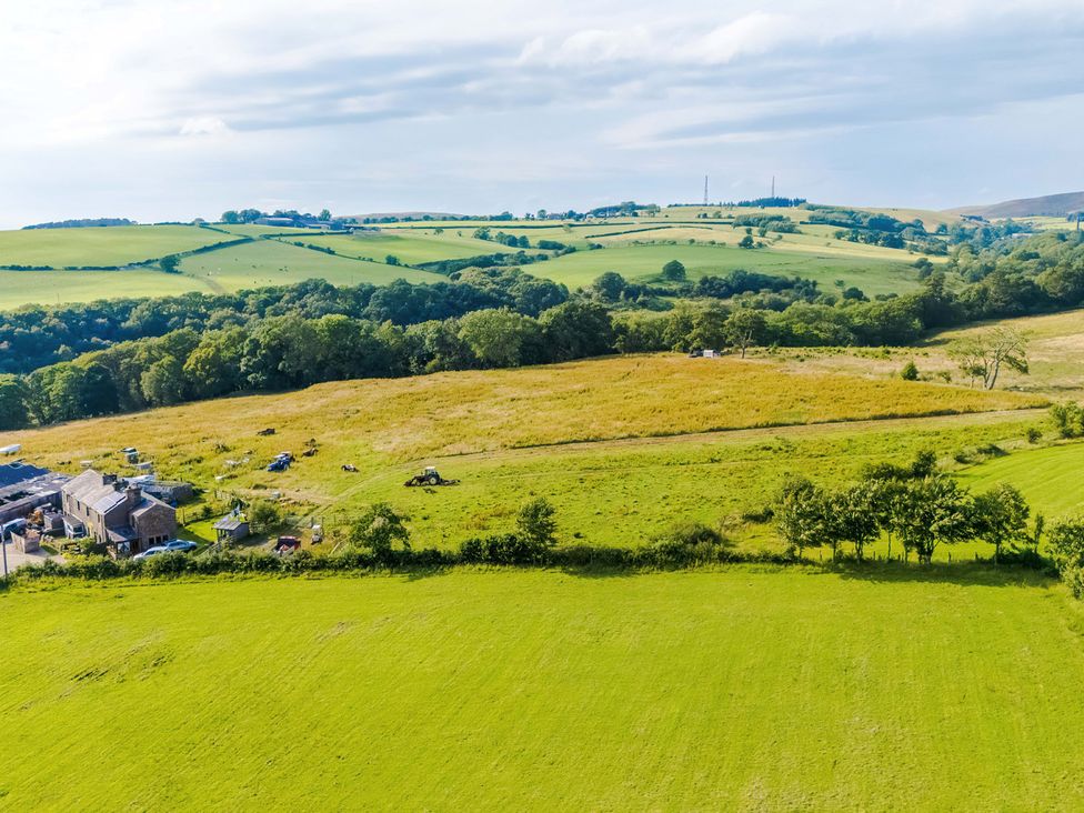 A landscape with fields and farm buildings at Landskill Farm in Preston