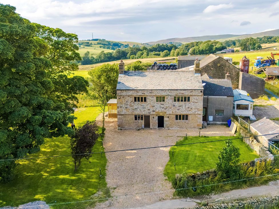 An outdoor view of a building with a driveway at Landskill Farm in Preston