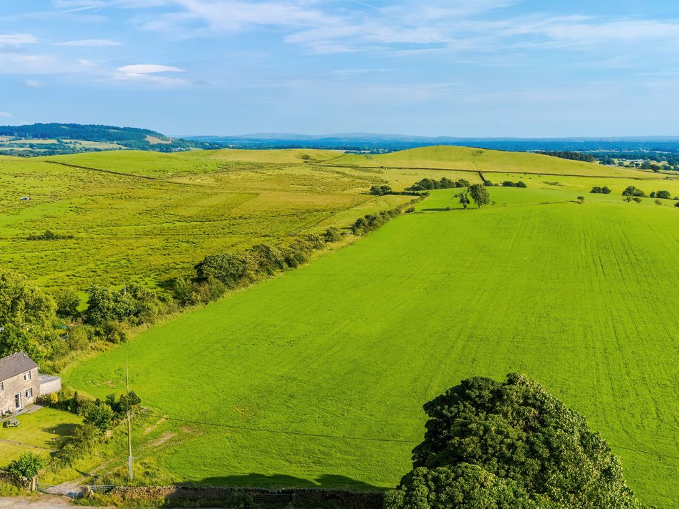 An outdoor view of green fields and a building at Landskill Farm, Preston
