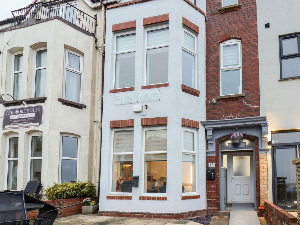 An entrance facade of a building with a sign at Frankie’s Seaview 1 Bridlington