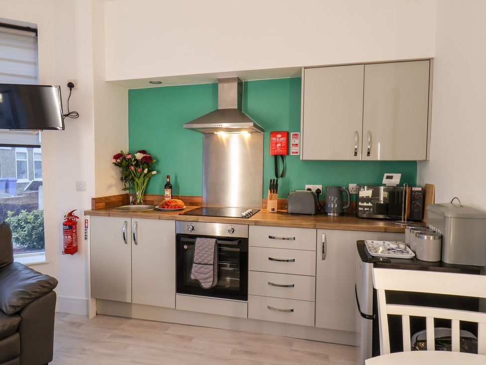 A kitchen with appliances and utensils at Frankie’s Seaview 1 in Bridlington