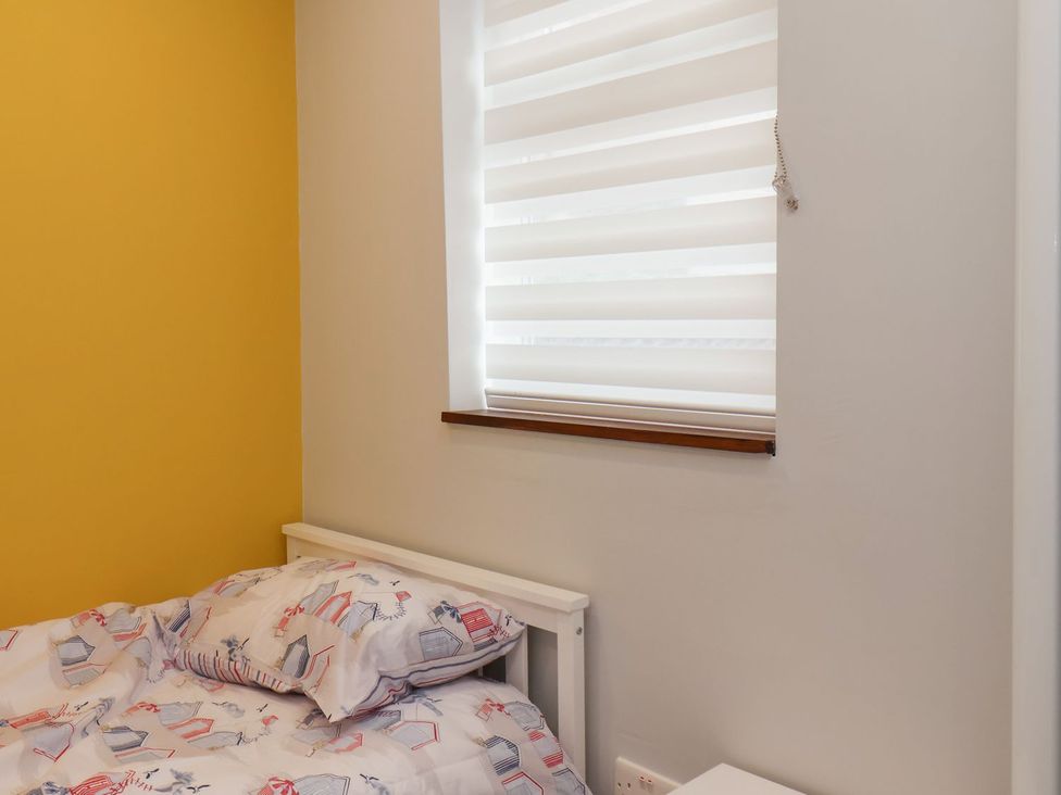 A bedroom with a bed and window at Frankie’s Seaview 2 in Bridlington