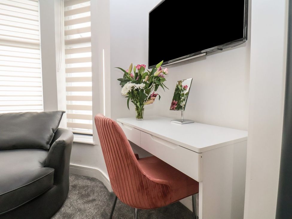 A workspace with a desk and chair at Frankie’s Seaview 4 in Bridlington