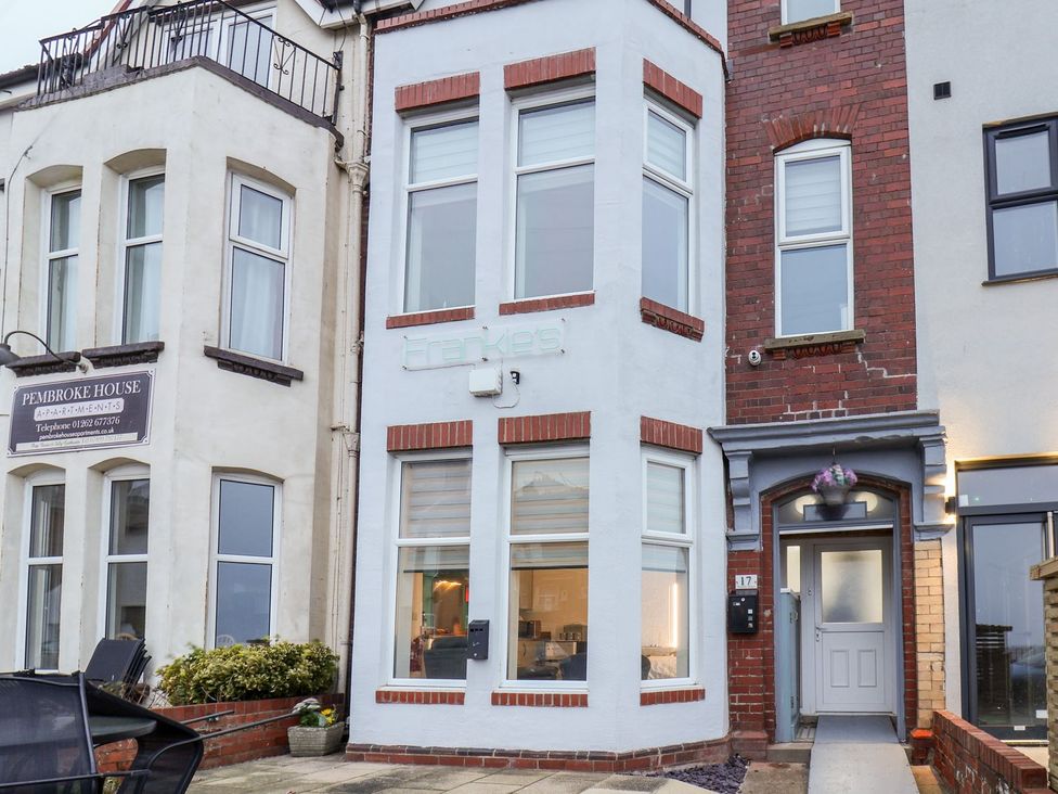 An exterior view of a building with a sign at Frankie’s Seaview 5 in Bridlington