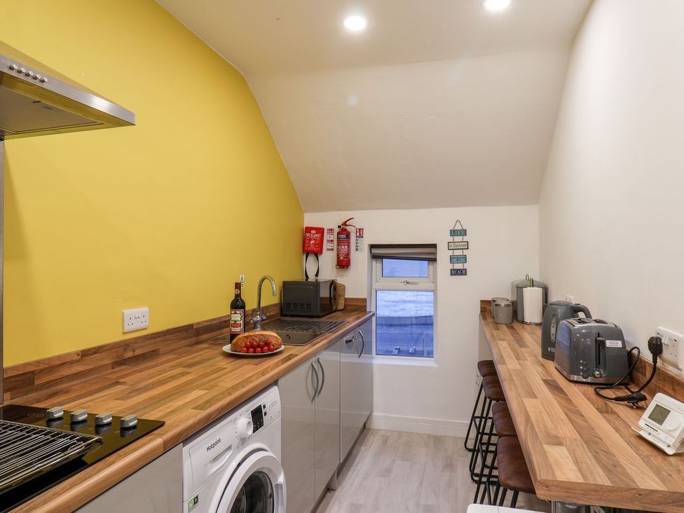 A kitchen with wooden countertops and appliances at Frankie’s Seaview 5 in Bridlington