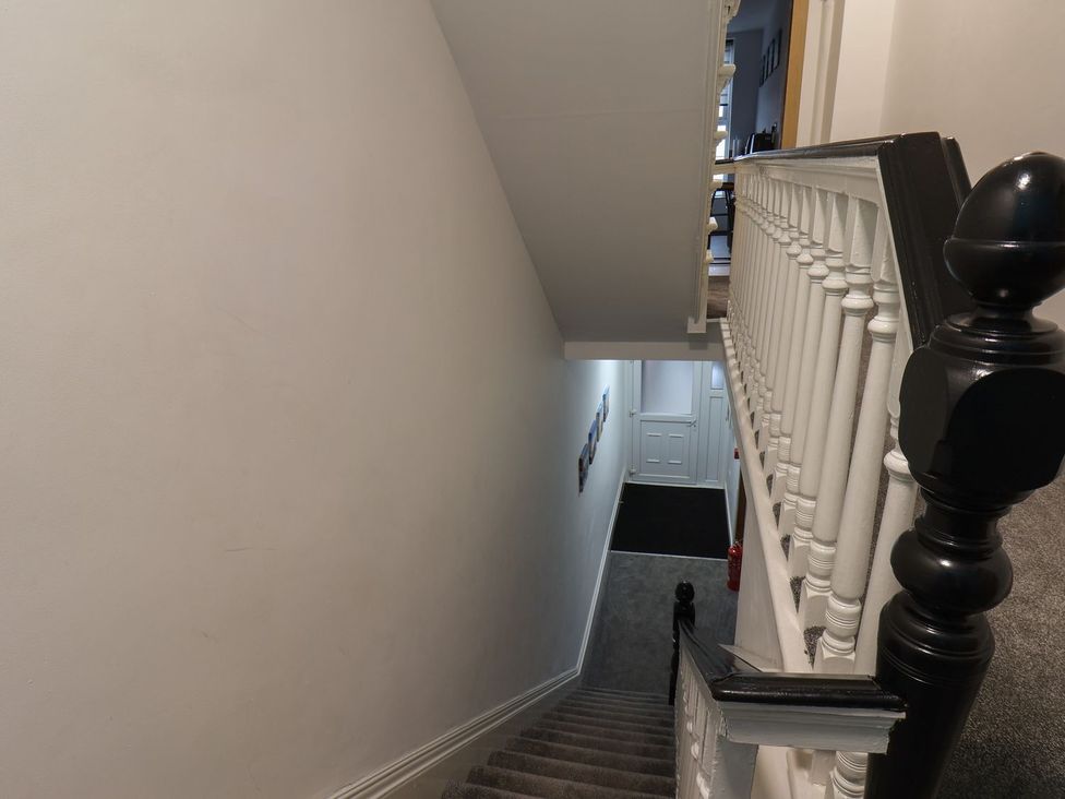 A staircase and railing in a hallway at Frankie’s Seaview 3 in Bridlington
