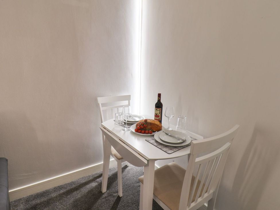 A dining table set with food and drinks at Frankie’s Seaview 3 in Bridlington