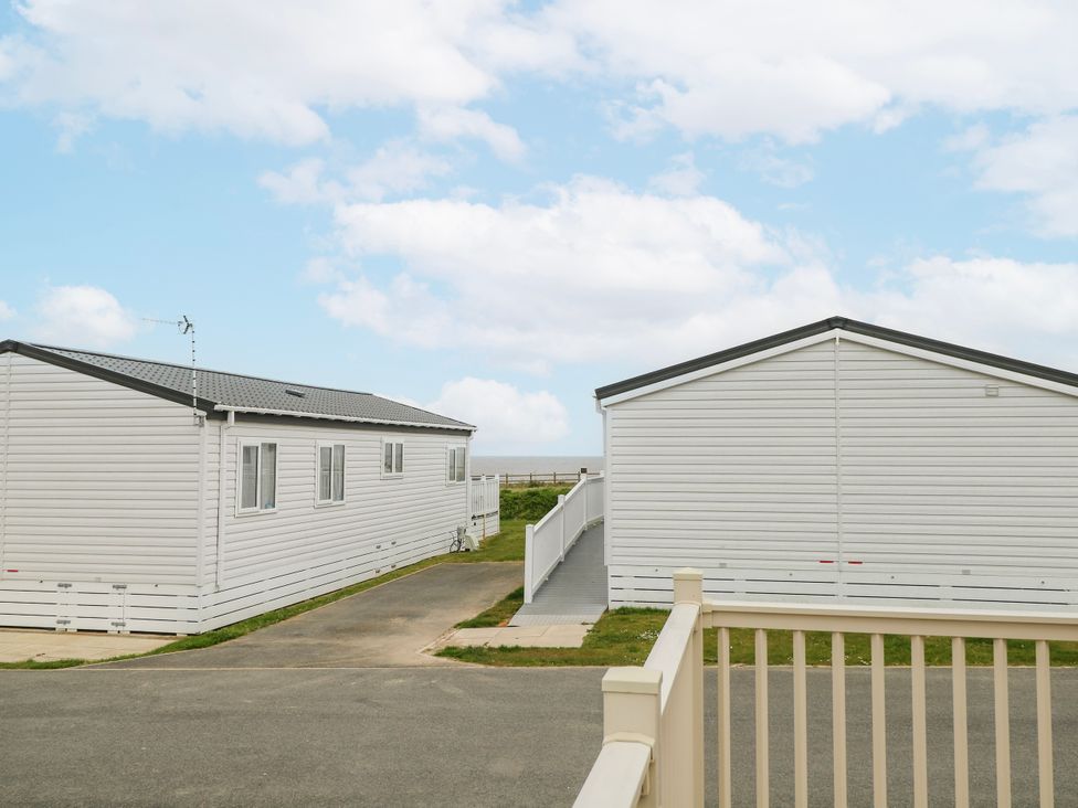 Static caravans and pathway at 59 Cliff Field Lowestoft