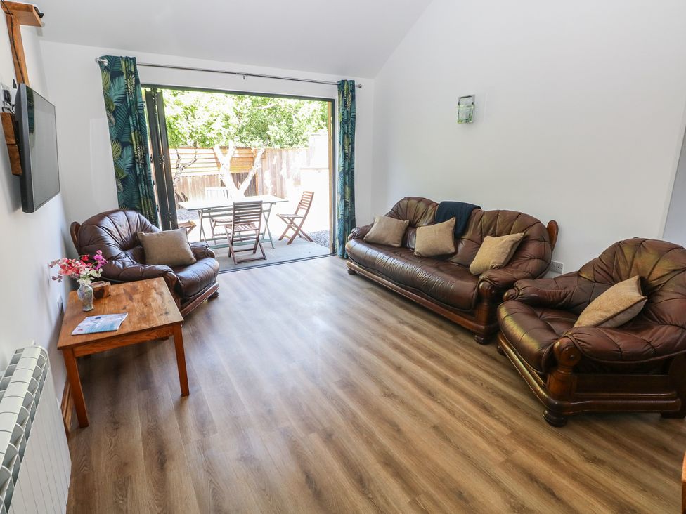 A living room with sofas and a coffee table at Brookview Kingfisher in Haverfordwest
