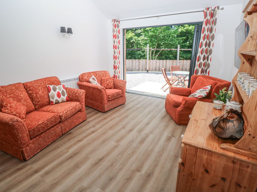 A living room with sofas and a coffee table at Brookview Goldfinch in Haverfordwest