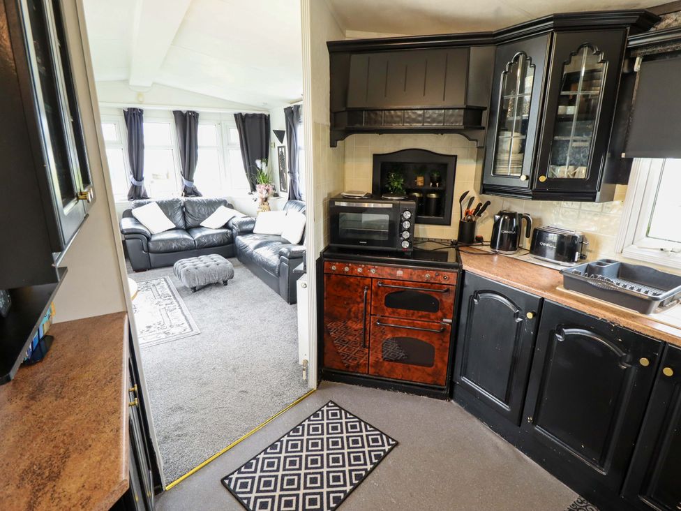 A kitchen with a microwave and oven at Towervans Z11 in Mablethorpe