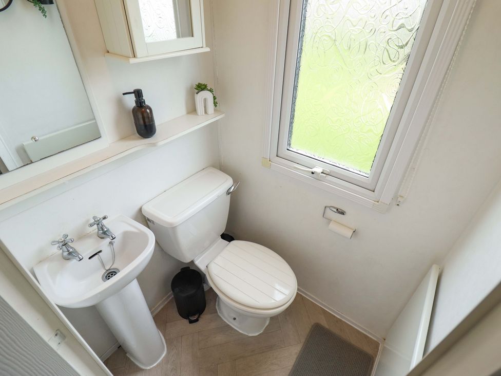 A bathroom with a toilet and sink at Towervans Z11 Mablethorpe